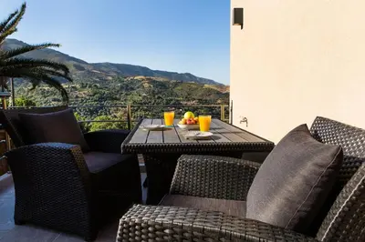 a patio with a table and chairs with a view at Cozy House Zoi -Top Views, On The Way To Elafonisi in Élos