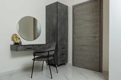a black chair in a room with a mirror at Cozy House Zoi -Top Views, On The Way To Elafonisi in Élos