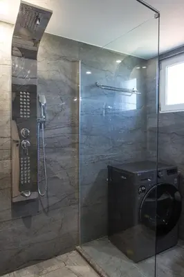 a shower with a washing machine in a bathroom at Cozy House Zoi -Top Views, On The Way To Elafonisi in Élos
