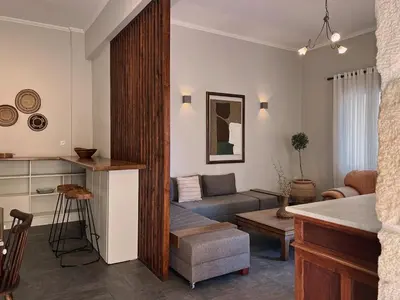 a living room with a couch and a table at Spiti an urban heaven in Chania Town
