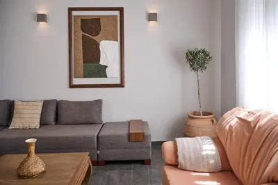 a living room with a couch and a table at Spiti an urban heaven in Chania Town