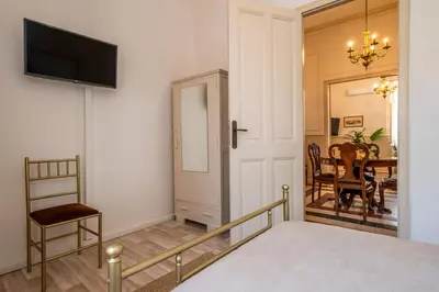 a room with a bed and a dining room at Le Nid The Nest of Beauty in Chania Town