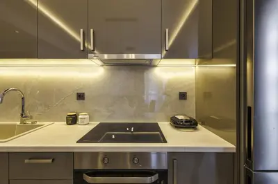 a kitchen with a stove and a sink at Jimmis Apartment in Chania Town
