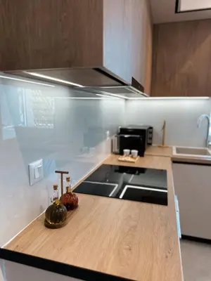 a kitchen with a counter with a stove and a sink at Dida stone home in Chania Town