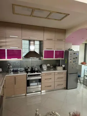 a kitchen with stainless steel appliances and purple cabinets at Casa Emanuel in Chania Town