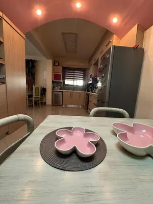 a table with two pink plates on top of it at Casa Emanuel in Chania Town