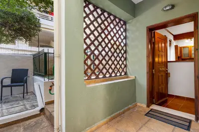 an open door of a house with a window at Spitatsi - Home with Yard in Chania Town