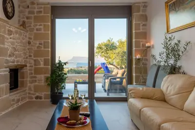 a living room with a couch and a table at ''Filoxenia'' of the 11 Brothers in Kissamos