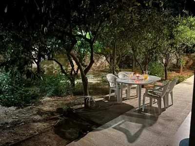 a white table and chairs sitting on a patio at Orange Tree in Chania Town
