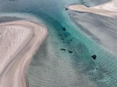 an aerial view of a beach and the ocean at Ikos Kissamos in Kissamos