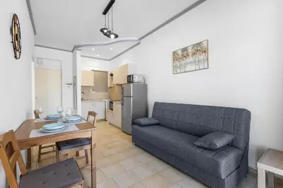 a living room with a couch and a table at Seafront Apartment in Chania 6 in Chania Town