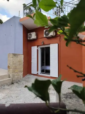 a house with a window and a balcony at Despoinas House in Plátanos