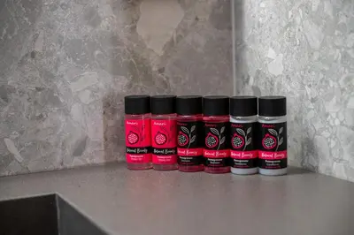 a group of four bottles of spices sitting on a counter at Villa Akalli in Frangokastello