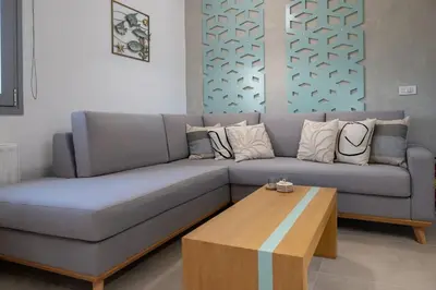 a living room with a couch and a coffee table at Villa Akalli in Frangokastello