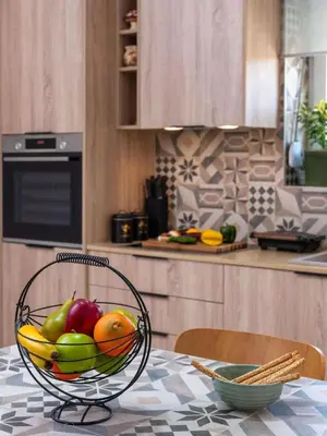 a bowl of fruit on a table in a kitchen at loupagio di mare in Plátanos