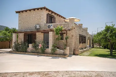 a brick house with plants in front of it at Villa Staria in Kirtomádhos