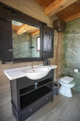 a bathroom with a sink and a toilet at Casa Luma near Loutraki beach in Chania
