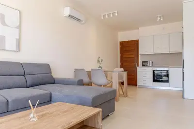 a living room with a couch and a table at Phaedrus Living Seaside Thalassa Cretan 103 in Módhion