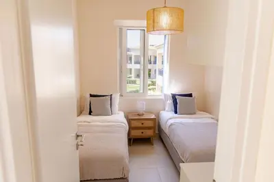 a room with two beds and a window at Phaedrus Living Seaside Thalassa Cretan 202 in Módhion
