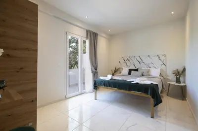 a bedroom with a bed and a large window at SI-EL Villa in Vryses