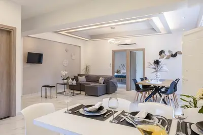 a living room with a couch and a table at SI-EL Villa in Vryses