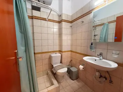 a bathroom with a toilet and a sink at Onar-estia in Chania Town
