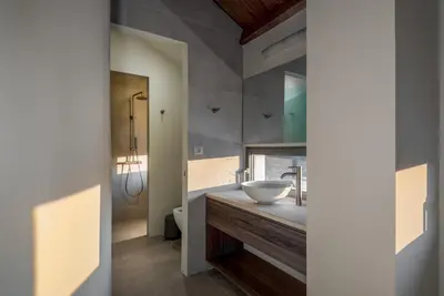 a bathroom with a sink and a toilet at Olive Hideaway Private Pool Villa, Chania Sleeps 7 in Kalamitsi Amygdali