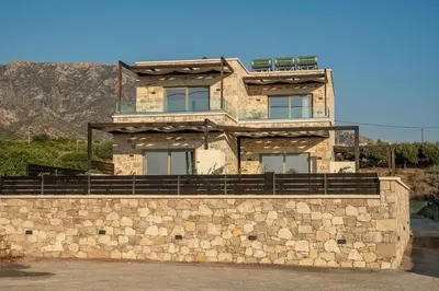 a building on top of a stone wall at Elafonisi Pearl in Elafonisi