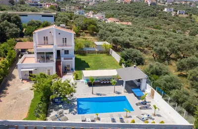 an aerial view of a house with a swimming pool at Myrto Villa heated pool in Kato Daratso