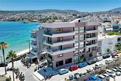 an aerial view of a building next to the ocean at Melina Apartments Sea & City in Chania Town