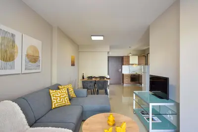 a living room with a couch and a table at Marena Apartments in Chania Town