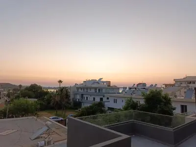 a view of the sunset from the roof of a building at MC Luxury Living in Chania Town