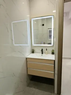 a bathroom with a sink and a window at MC Luxury Living in Chania Town