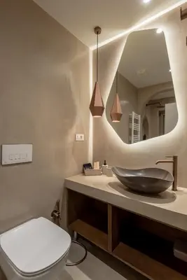a bathroom with a sink and a toilet and a mirror at Devina Residence 2025 , Luxury City Jacuzzi Apartment in Chania Town