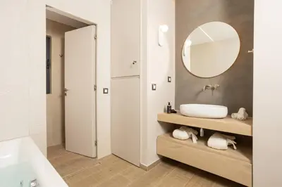 a bathroom with a sink and a mirror at Kira Elegant City Nest in Chania Town