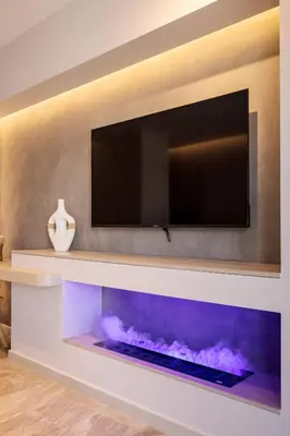 a tv mounted on a wall with a fish tank at Kira Elegant City Nest in Chania Town