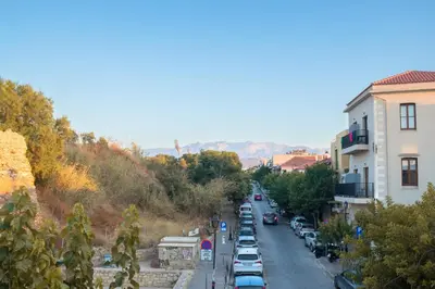 a street with cars parked on the side of a road at Edward Luxury Suites in Chania Town