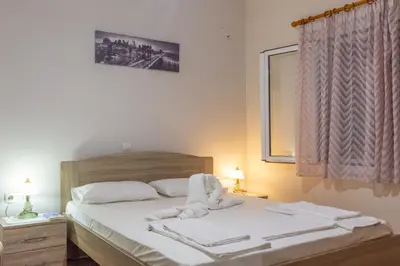 a bedroom with a bed with towels on it at Depi's Home in Kissamos