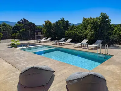 a swimming pool with lounge chairs next to at PanStel - Villa Solene with private pool in Ayiá