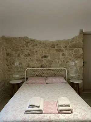 a bed with two towels on it in a bedroom at Casa Maria in Gramvousá