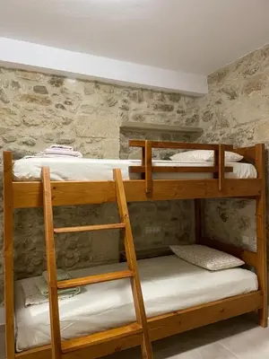 a couple of bunk beds in a room at Casa Maria in Gramvousá