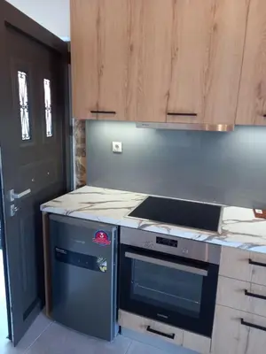 a kitchen with a stove and a counter top at Villa Makyva in Kámboi