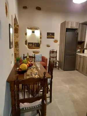 a kitchen with a table with fruit on it at Villa Makyva in Kámboi