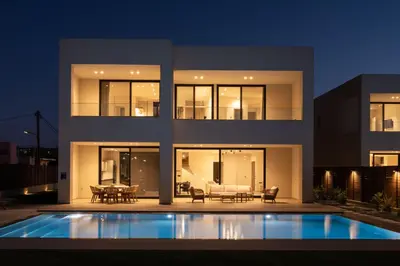 a house with a swimming pool at night at Gemini Villas Chania - Calma & Siesta in Maleme