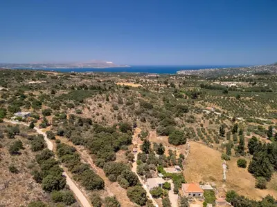 an aerial view of a house with trees at Echoes of Prinos in Metókhion Yianítsari