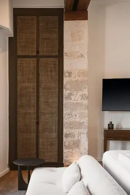 a bedroom with a bed and a sliding glass door at Evrima High End Residence in Chania Town