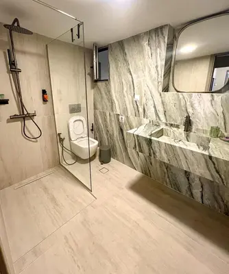 a bathroom with a toilet and a sink at CASA 7 urban 3 bedroom apartment in Chania Town