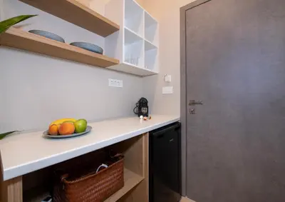 a kitchen with a counter with a bowl of fruit at Alba Boutique Hotel in Chania Town