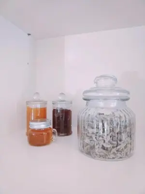 a group of jars with different types of liquids at RosaMaria's Garden in Kounoupidhianá