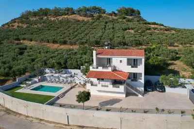 an aerial view of a house with a mountain at Olea Retreat Villa in Yerakianá